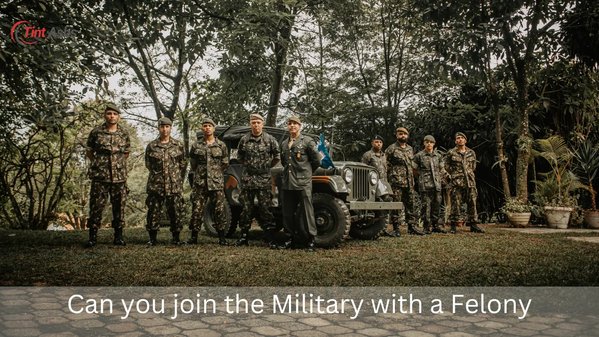 Group of soldiers in military uniforms posing beside a vehicle, representing the inquiry: can you join the military with a felony?