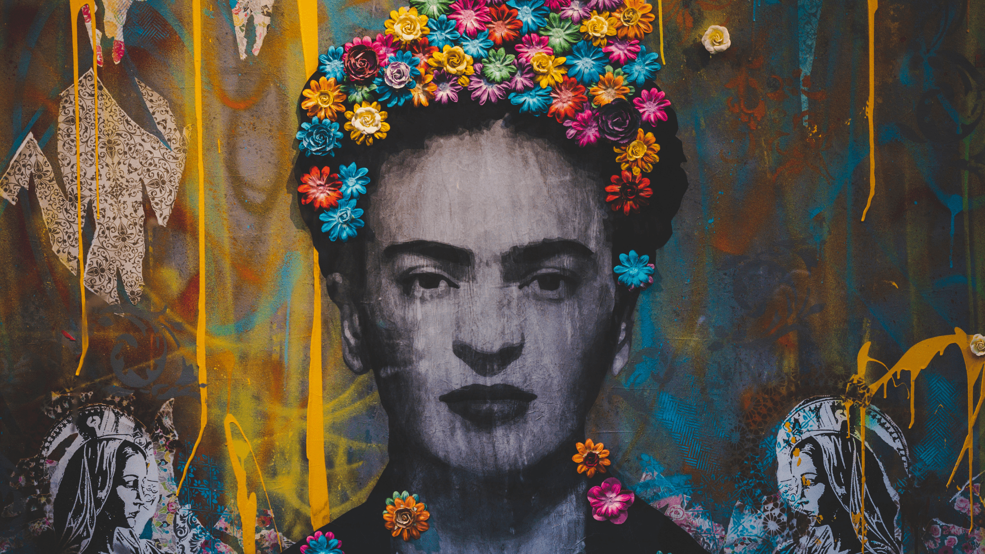 A vibrant street art mural featuring a black-and-white portrait adorned with colorful flowers, illustrating the artistic expression in "Art vs. Design in Creative Industry.