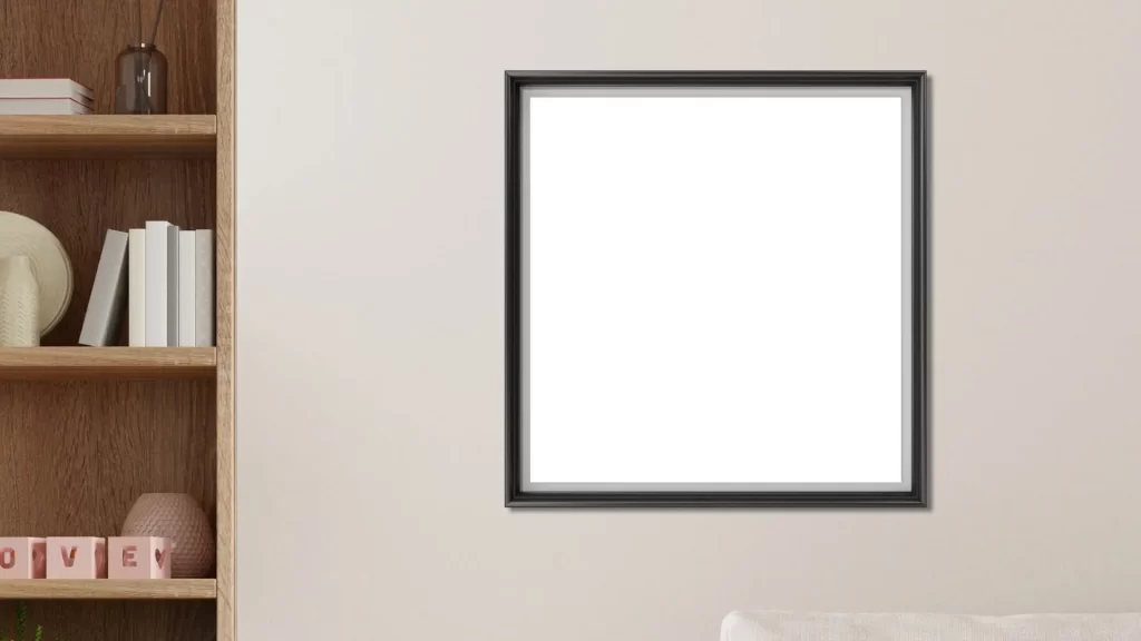 A black-framed Minimalist Aesthetic Wall Art piece on a beige wall near a wooden shelf with books.