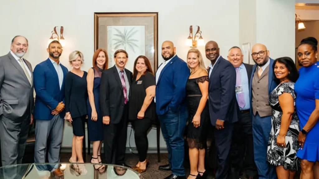 A group of professionals celebrating at the Miramar Business Awards event.